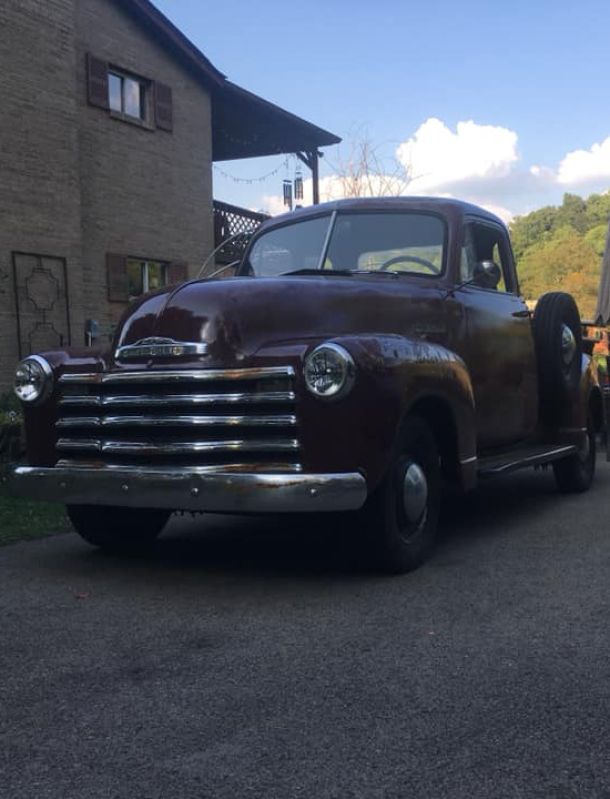 Our vintage 52' Chevy truck parked outside the farm