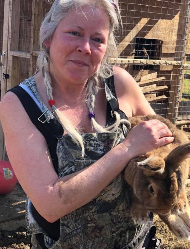 Photo of Michelle, owner and operator of Green Goose Farm, and her bunny